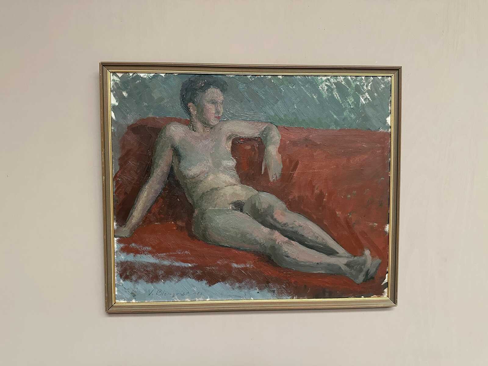 “Reclining Lady on Red Couch” by Vilhelm Blomquist