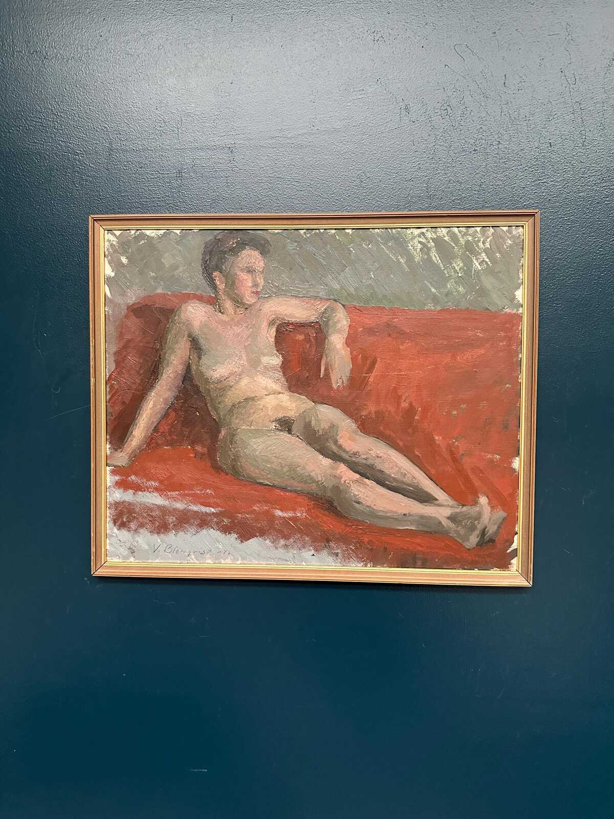 “Reclining Lady on Red Couch” by Vilhelm Blomquist