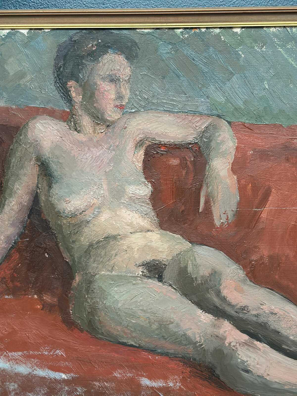 “Reclining Lady on Red Couch” by Vilhelm Blomquist