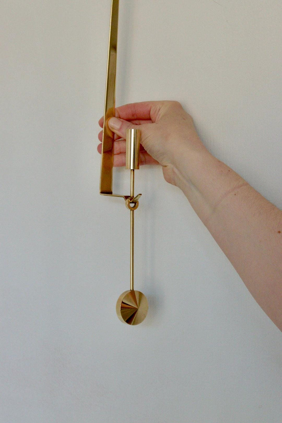 Swedish Brass sconce by Pierre Forsell for Skultuna " Pendeln"