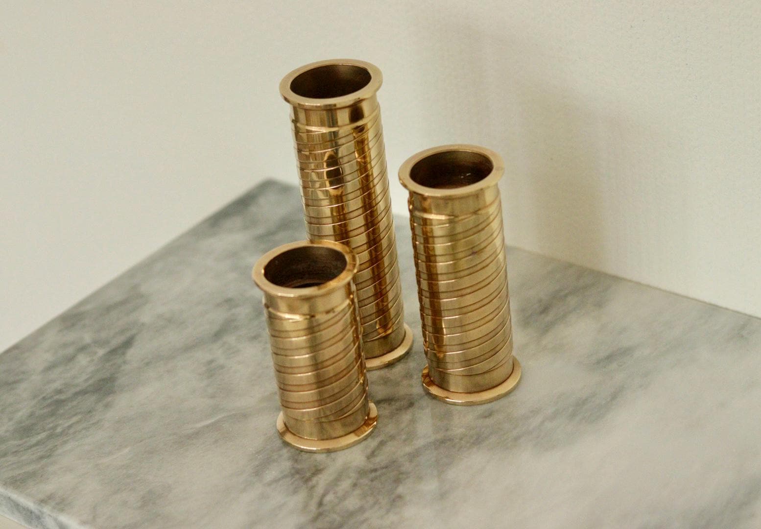 Trio of Mid-Century Swedish Brass Candle Holders