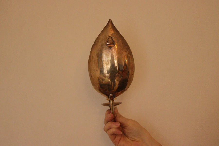 A Pair of Vintage Brass Sconces in Hammered Leaf Shape