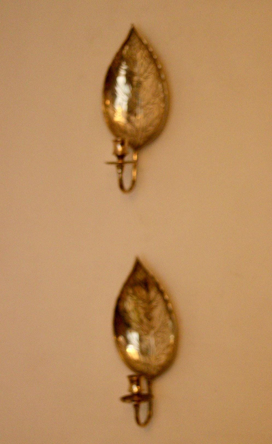 A Pair of Vintage Brass Sconces in Hammered Leaf Shape