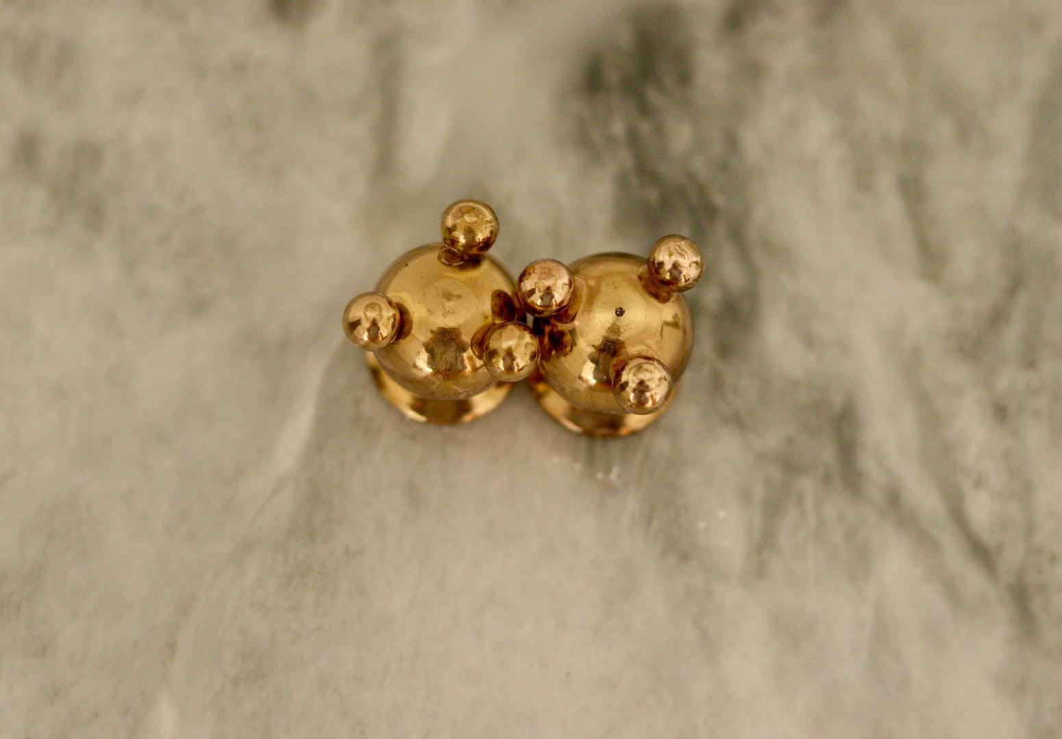 Pair of Mid-Century Swedish Brass Candle Holders