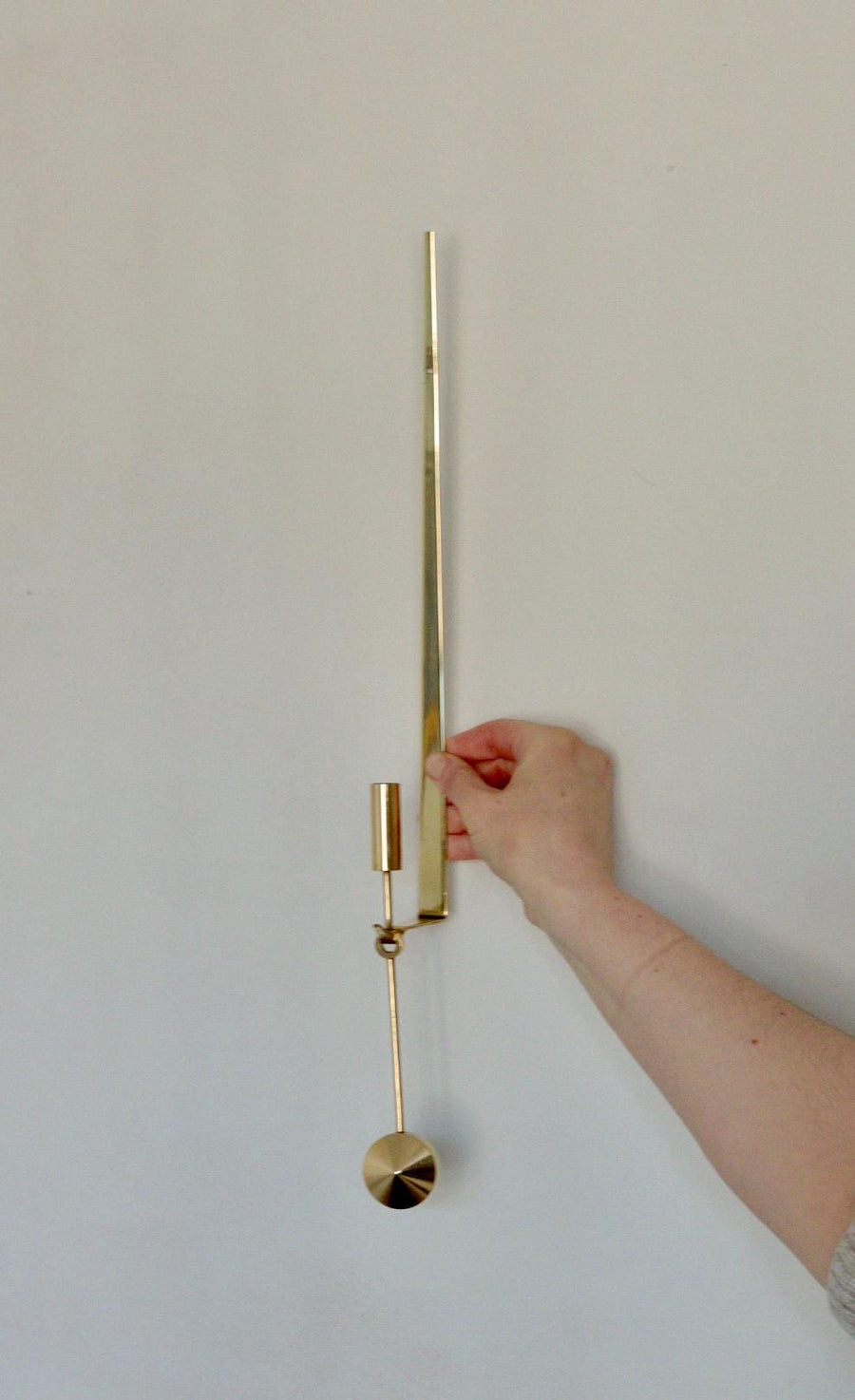 Swedish Brass sconce by Pierre Forsell for Skultuna " Pendeln"