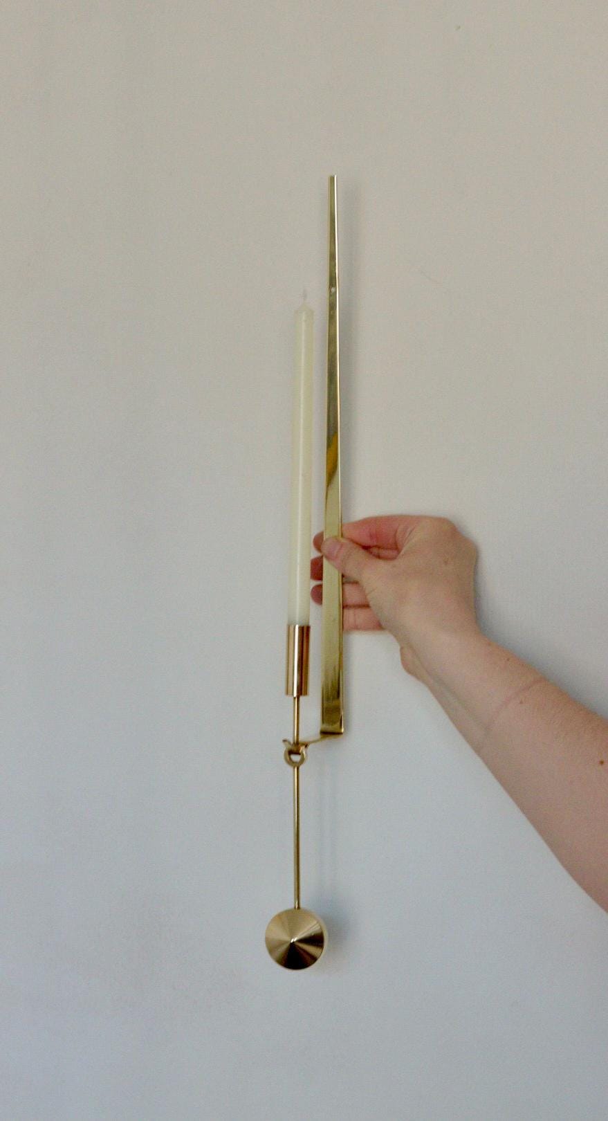 Swedish Brass sconce by Pierre Forsell for Skultuna " Pendeln"