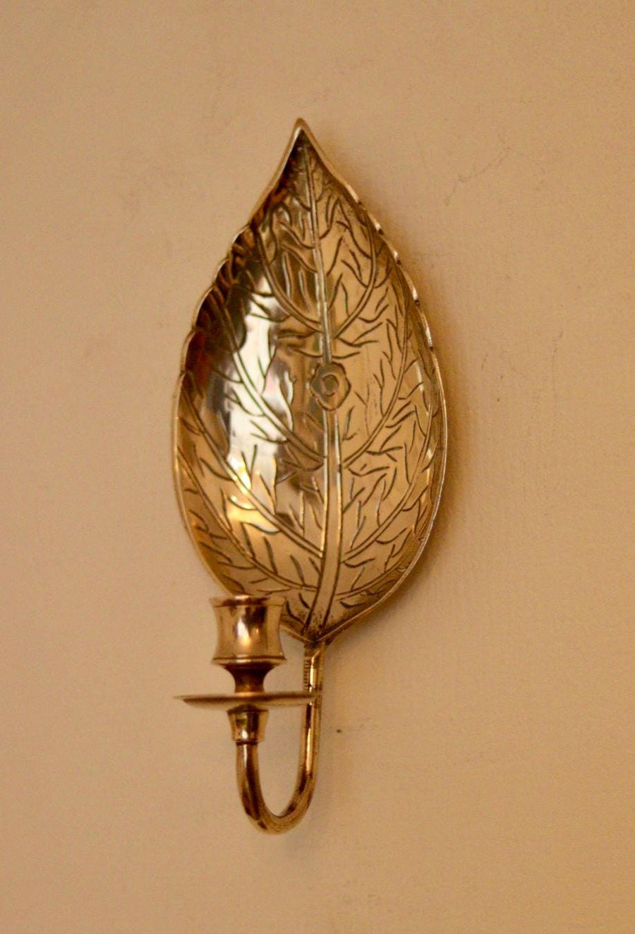 A Pair of Vintage Brass Sconces in Hammered Leaf Shape