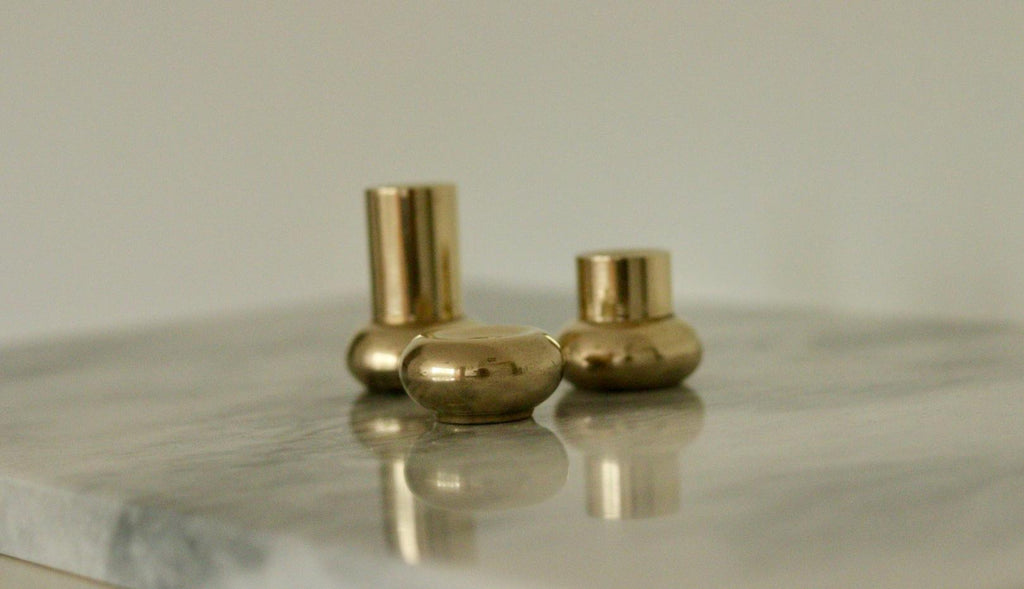 Trio of Mid-Century Swedish Brass Candle Holders