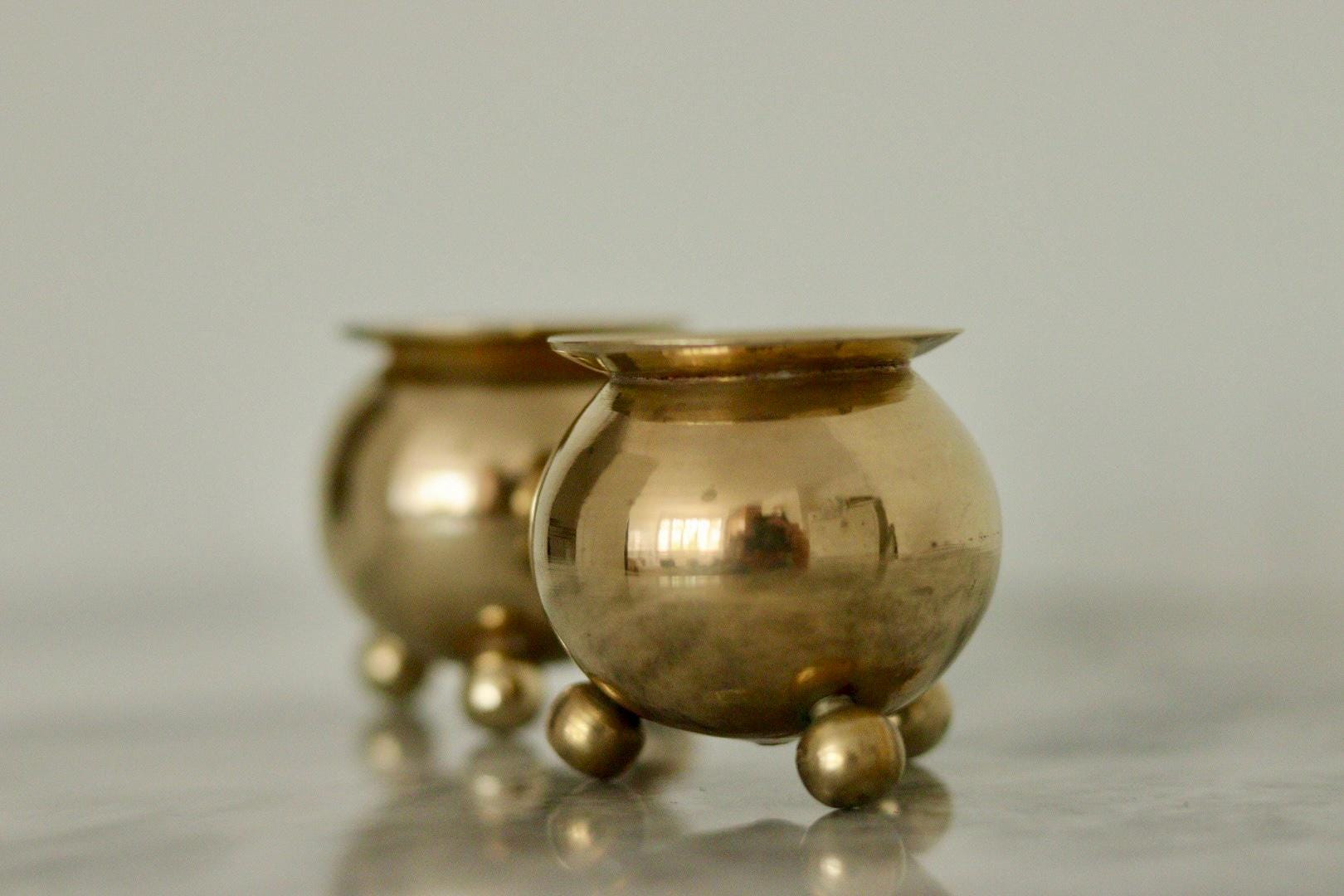 Pair of Mid-Century Swedish Brass Candle Holders